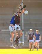 6 January 2024; Dylan Murtagh of Westmeath and Darren Gallagher of Longford compete for a high ball during the Dioralyte O'Byrne Cup quarter-final match between Longford and Westmeath at Glennon Brothers Pearse Park in Longford. Photo by Ben McShane/Sportsfile