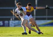 6 January 2024; Brian Byrne of Kildare in action against Dean O'Toole of Wexford during the Dioralyte O'Byrne Cup quarter-final match between Wexford and Kildare at Chadwicks Wexford Park in Wexford. Photo by Sam Barnes/Sportsfile