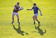 6 January 2024; Daragh Lowry of Westmeath in action against Daniel Reynolds of Longford during the Dioralyte O'Byrne Cup quarter-final match between Longford and Westmeath at Glennon Brothers Pearse Park in Longford. Photo by Ben McShane/Sportsfile