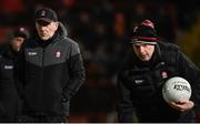 6 January 2024; Derry manager Mickey Harte, left, and coach Gavin Devlin before the Bank of Ireland Dr McKenna Cup Group B match between Derry and Down at Celtic Park in Derry. Photo by Ramsey Cardy/Sportsfile