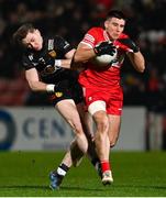 6 January 2024; Conor Doherty of Derry in action against Ryan McEvoy of Down during the Bank of Ireland Dr McKenna Cup Group B match between Derry and Down at Celtic Park in Derry. Photo by Ramsey Cardy/Sportsfile