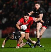 6 January 2024; Conor Doherty of Derry in action against Johnny Flynn  of Down during the Bank of Ireland Dr McKenna Cup Group B match between Derry and Down at Celtic Park in Derry. Photo by Ramsey Cardy/Sportsfile