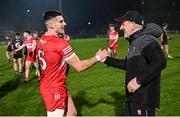 6 January 2024; Derry manager Mickey Harte, right, and Conor Doherty of Derry after the Bank of Ireland Dr McKenna Cup Group B match between Derry and Down at Celtic Park in Derry. Photo by Ramsey Cardy/Sportsfile