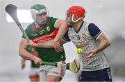 6 January 2024; Ruadhan Mulrooney of New York in action against Luke Connor of Mayo during the Connacht Hurling League Cup final match between New York and Mayo at University of Galway Connacht GAA AirDome in Bekan, Mayo. Photo by Tyler Miller/Sportsfile