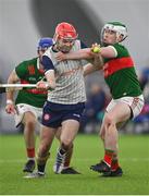 6 January 2024; Ruadhan Mulrooney of New York in action against Matthew Connor of Mayo during the Connacht Hurling League Cup final match between New York and Mayo at University of Galway Connacht GAA AirDome in Bekan, Mayo. Photo by Tyler Miller/Sportsfile