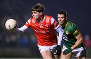 6 January 2024; Peter McStravick of Louth in action against Donal Keogan of Meath during the Dioralyte O'Byrne Cup quarter-final match between Meath and Louth at Donaghmore Ashbourne GAA Club in Ashbourne, Meath. Photo by Seb Daly/Sportsfile