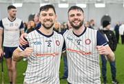 6 January 2024; New York joint captains Darragh Hynes, left, and David Mangan celebrate after their side's victory in the Connacht Hurling League Cup final match between New York and Mayo at University of Galway Connacht GAA AirDome in Bekan, Mayo. Photo by Tyler Miller/Sportsfile