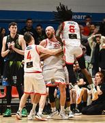 6 January 2024; Keelan Cairns of Ballincollig celebrates with teammates after shooting a last minute winning backet during the Basketball Ireland Pat Duffy National Cup semi-final match between Garvey’s Tralee Warriors and Irish Guide Dogs Ballincollig at Neptune Stadium in Cork. Photo by Eóin Noonan/Sportsfile