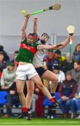 6 January 2024; Adrian Phillips of Mayo and Adam Loughlin Stones of New York battle for possession during the Connacht Hurling League Cup final match between New York and Mayo at University of Galway Connacht GAA AirDome in Bekan, Mayo. Photo by Tyler Miller/Sportsfile
