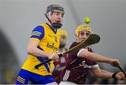6 January 2024; Sean Canning of Roscommon in action against Micheál Lyons of Galway during the Connacht Hurling League Shield final match between Roscommon and Galway at University of Galway Connacht GAA AirDome in Bekan, Mayo. Photo by Tyler Miller/Sportsfile
