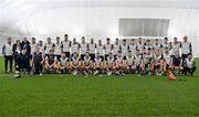 6 January 2024; The New York panel and staff pose for a team photograph before the Connacht Hurling League Cup final match between New York and Mayo at University of Galway Connacht GAA AirDome in Bekan, Mayo. Photo by Tyler Miller/Sportsfile