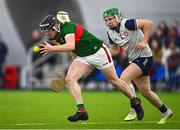 6 January 2024; Evan Hearty of Mayo breaks clear from Aidan Organ of New York during the Connacht Hurling League Cup final match between New York and Mayo at University of Galway Connacht GAA AirDome in Bekan, Mayo. Photo by Tyler Miller/Sportsfile