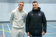 20 March 2023; Republic of Ireland U21 international Killian Phillips with Denis Hyland, FAI Football Development Officer with Fingal County, on a visit to the Football and Fitness Transition Year course in Corduff Sports Centre, Dublin. Photo by Stephen McCarthy/Sportsfile