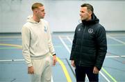 20 March 2023; Republic of Ireland U21 international Killian Phillips with Denis Hyland, FAI Football Development Officer with Fingal County, on a visit to the Football and Fitness Transition Year course in Corduff Sports Centre, Dublin. Photo by Stephen McCarthy/Sportsfile