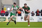 7 January 2024; Aidan McLoughlin of London in action against Eoghan McLoughlin of Mayo during the Connacht FBD League quarter-final match between Mayo and London at University of Galway Connacht GAA AirDome in Bekan, Mayo. Photo by Tyler Miller/Sportsfile