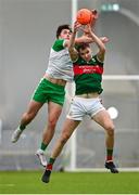 7 January 2024; Conor Reid of Mayo and Liam Gallagher of London battle for possession during the Connacht FBD League quarter-final match between Mayo and London at University of Galway Connacht GAA AirDome in Bekan, Mayo. Photo by Tyler Miller/Sportsfile