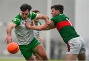 7 January 2024; Liam Gallagher of London in action against Frank Irwin of Mayo during the Connacht FBD League quarter-final match between Mayo and London at University of Galway Connacht GAA AirDome in Bekan, Mayo. Photo by Tyler Miller/Sportsfile