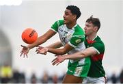7 January 2024; Josh Obahor of London in action against Conor Reid of Mayo during the Connacht FBD League quarter-final match between Mayo and London at University of Galway Connacht GAA AirDome in Bekan, Mayo. Photo by Tyler Miller/Sportsfile
