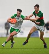 7 January 2024; Liam Gallagher of London in action against Conor Reid of Mayo during the Connacht FBD League quarter-final match between Mayo and London at University of Galway Connacht GAA AirDome in Bekan, Mayo. Photo by Tyler Miller/Sportsfile
