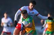 7 January 2024; Peadar Mogan of Donegal is tackled by Michael McKernan of Tyrone during the Bank of Ireland Dr McKenna Cup Group A match between Tyrone and Donegal at O’Neills Healy Park in Omagh, Tyrone. Photo by Ramsey Cardy/Sportsfile
