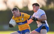 7 January 2024; Gavin Murray of Clare in action against Donie Fitzgerald of Waterford during the McGrath Cup group B match between Waterford and Clare at Páirc Naomh Brid in Lemybrien, Waterford. Photo by Seb Daly/Sportsfile