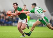 7 January 2024; Conor Hunt of Mayo in action against DJ O'Flaherty of London during the Connacht FBD League quarter-final match between Mayo and London at University of Galway Connacht GAA AirDome in Bekan, Mayo. Photo by Tyler Miller/Sportsfile