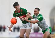 7 January 2024; Aaron McDonnell of Mayo in action against Eoin Walsh of London during the Connacht FBD League quarter-final match between Mayo and London at University of Galway Connacht GAA AirDome in Bekan, Mayo. Photo by Tyler Miller/Sportsfile