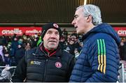 7 January 2024; Tyrone joint-manager Feargal Logan, left, and Donegal manager Jim McGuinness after the Bank of Ireland Dr McKenna Cup Group A match between Tyrone and Donegal at O’Neills Healy Park in Omagh, Tyrone. Photo by Ramsey Cardy/Sportsfile