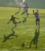 7 January 2024; Oisin Caulfield of Donegal kicks a point despite the efforts of Conall Devlin of Tyrone during the Bank of Ireland Dr McKenna Cup Group A match between Tyrone and Donegal at O’Neills Healy Park in Omagh, Tyrone. Photo by Ramsey Cardy/Sportsfile