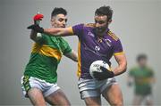 7 January 2024; Shane Horan of Kilmacud Crokes is tackled by Danny Tallon of Glen during the AIB GAA Football All-Ireland Senior Club Championship semi-final match between Kilmacud Crokes of Dublin, and Glen of Derry, at Páirc Esler in Newry, Down. Photo by Ben McShane/Sportsfile