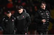 6 January 2024; Derry manager Mickey Harte, left, and coach Gavin Devlin before the Bank of Ireland Dr McKenna Cup Group B match between Derry and Down at Celtic Park in Derry. Photo by Ramsey Cardy/Sportsfile