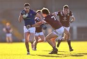 6 January 2024; Darren Gallagher of Longford gets past the tackle of Tadhg Baker of Westmeath during the Dioralyte O'Byrne Cup quarter-final match between Longford and Westmeath at Glennon Brothers Pearse Park in Longford. Photo by Ben McShane/Sportsfile