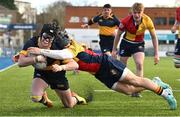 9 January 2024; Cian Behal of The King's Hospital dives over to score his side's first try despite the efforts of Giovanni Nostro of St Fintan's during the Bank of Ireland Vinnie Murray Cup Round 1 match between The Kings Hospital and St Fintan's High School at Energia Park in Dublin. Photo by Tyler Miller/Sportsfile