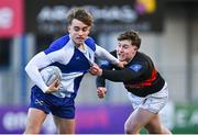 9 January 2024; Victor Killane of St Andrews College in action against Elliot Walsh of The High School during the Bank of Ireland Vinnie Murray Cup Round 1 match between The High School and St Andrews College at Energia Park in Dublin. Photo by Tyler Miller/Sportsfile