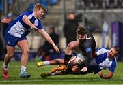 9 January 2024; James Cox of The High School in action against Simon O'Kelly, left, and Elliot Reidy of St Andrews College during the Bank of Ireland Vinnie Murray Cup Round 1 match between The High School and St Andrews College at Energia Park in Dublin. Photo by Tyler Miller/Sportsfile