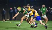 10 January 2024; Dan Morrissey of Limerick is tackled by Diarmuid Cahill and David Reidy, behind, of Clare during the Co-Op Superstores Munster Hurling League Group A match between Clare and Limerick at Clarecastle GAA astro pitch in Clare. Photo by Piaras Ó Mídheach/Sportsfile