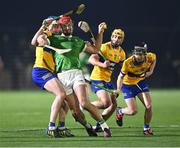 10 January 2024; Colin Coughlan of Limerick in action against Clare players, from left, Diarmuid Ryan, David Conroy and Diarmuid Cahill during the Co-Op Superstores Munster Hurling League Group A match between Clare and Limerick at Clarecastle GAA astro pitch in Clare. Photo by Piaras Ó Mídheach/Sportsfile