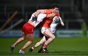 10 January 2024; Ciaran Higgins of Armagh is tackled by Michael McKernan of Tyrone during the Bank of Ireland Dr McKenna Cup Group A match between Armagh and Tyrone at BOX-IT Athletic Grounds in Armagh. Photo by Ben McShane/Sportsfile