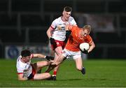 10 January 2024; Cian McConville of Armagh in action against Conall Devlin, 2, and Lorcan McGarrity of Tyrone during the Bank of Ireland Dr McKenna Cup Group A match between Armagh and Tyrone at BOX-IT Athletic Grounds in Armagh. Photo by Ben McShane/Sportsfile