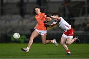 10 January 2024; Darragh McMullan of Armagh in action against Aiden Clarke of Tyrone during the Bank of Ireland Dr McKenna Cup Group A match between Armagh and Tyrone at BOX-IT Athletic Grounds in Armagh. Photo by Ben McShane/Sportsfile