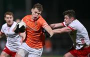 10 January 2024; Oisin O'Neill of Armagh is tackled by Ben Cullen of Tyrone during the Bank of Ireland Dr McKenna Cup Group A match between Armagh and Tyrone at BOX-IT Athletic Grounds in Armagh. Photo by Ben McShane/Sportsfile