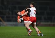 10 January 2024; Niall Grimley of Armagh is tackled by Niall Devlin of Tyrone during the Bank of Ireland Dr McKenna Cup Group A match between Armagh and Tyrone at BOX-IT Athletic Grounds in Armagh. Photo by Ben McShane/Sportsfile