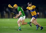 10 January 2024; Adam English of Limerick in action against John Conneally of Clare during the Co-Op Superstores Munster Hurling League Group A match between Clare and Limerick at Clarecastle GAA astro pitch in Clare. Photo by Piaras Ó Mídheach/Sportsfile