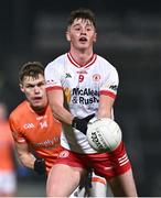 10 January 2024; Conor Owens of Tyrone and Oisin O'Neill of Armagh during the Bank of Ireland Dr McKenna Cup Group A match between Armagh and Tyrone at BOX-IT Athletic Grounds in Armagh. Photo by Ben McShane/Sportsfile