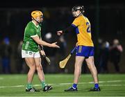 10 January 2024; Adam English of Limerick shakes hands with John Conneally of Clare as he's substituted during the Co-Op Superstores Munster Hurling League Group A match between Clare and Limerick at Clarecastle GAA astro pitch in Clare. Photo by Piaras Ó Mídheach/Sportsfile