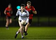10 January 2024; Emmett Magee of Ulster University in action against Mark Cooper of UCC during the Electric Ireland Higher Education GAA Sigerson Cup Round 1 match between Ulster University and UCC at the GAA National Games Development Centre in Abbotstown, Dublin. Photo by Stephen Marken/Sportsfile