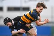 11 January 2024; Lewis Keary of The King’s Hospital is tackled by Ruairi O’Luanaigh-Hall of The High School during the Bank of Ireland Fr Godfrey Cup Round 1 match between The King's Hospital and The High School at Energia Park in Dublin. Photo by Seb Daly/Sportsfile