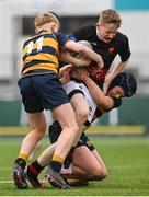 11 January 2024; Patrick Slattery Reilly of The High School is tackled by David Coakley, left, and Harry Quinn of The King’s Hospital during the Bank of Ireland Fr Godfrey Cup Round 1 match between The King's Hospital and The High School at Energia Park in Dublin. Photo by Seb Daly/Sportsfile