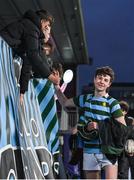 11 January 2024; Luke Redmond of St Gerard's School celebrates with a supporter after their side's victory in the Bank of Ireland Fr Godfrey Cup Round 1 match between Skerries Community College and St Gerards School at Energia Park in Dublin. Photo by Seb Daly/Sportsfile