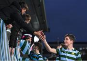 11 January 2024; Niklas Leddy of St Gerard's School celebrates with a supporter after their side's victory in the Bank of Ireland Fr Godfrey Cup Round 1 match between Skerries Community College and St Gerards School at Energia Park in Dublin. Photo by Seb Daly/Sportsfile